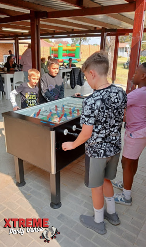Children playing table games at Xtremevents